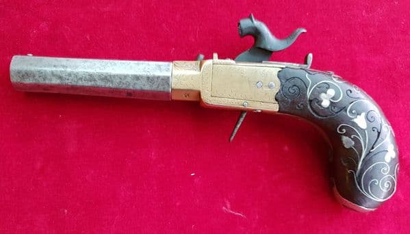 An octagonal barrel side-hammer percussion pistol by W. Hole Bristol. Circa 1840. Ref 1914